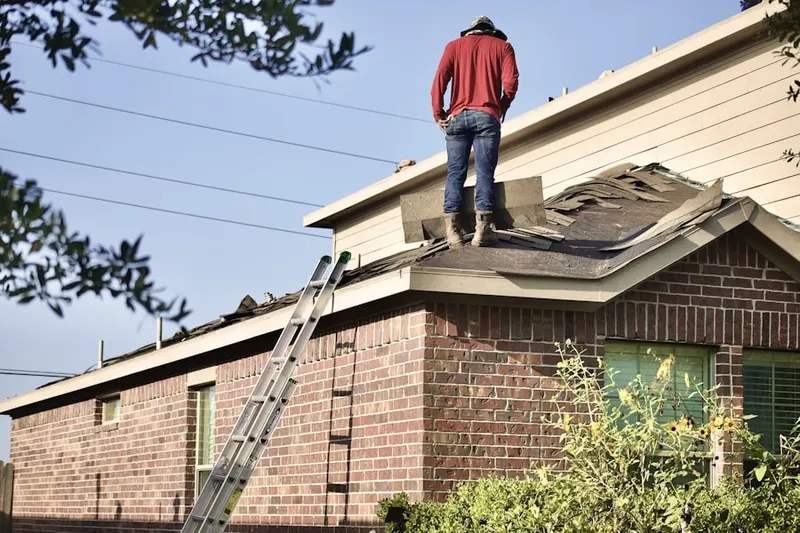 Professional roofer working on a residential roof in Sonterra